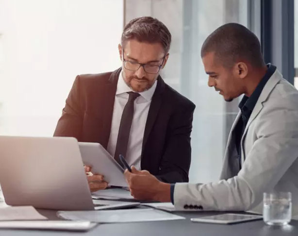 Professional conducting facility analysis with tablet